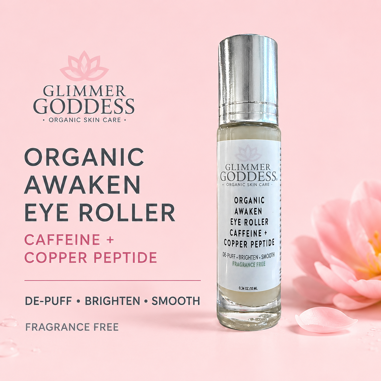 Glimmer Goddess Organic Awaken Eye Roller bottle on a soft pink background with decorative flower petals and large product text on the left.