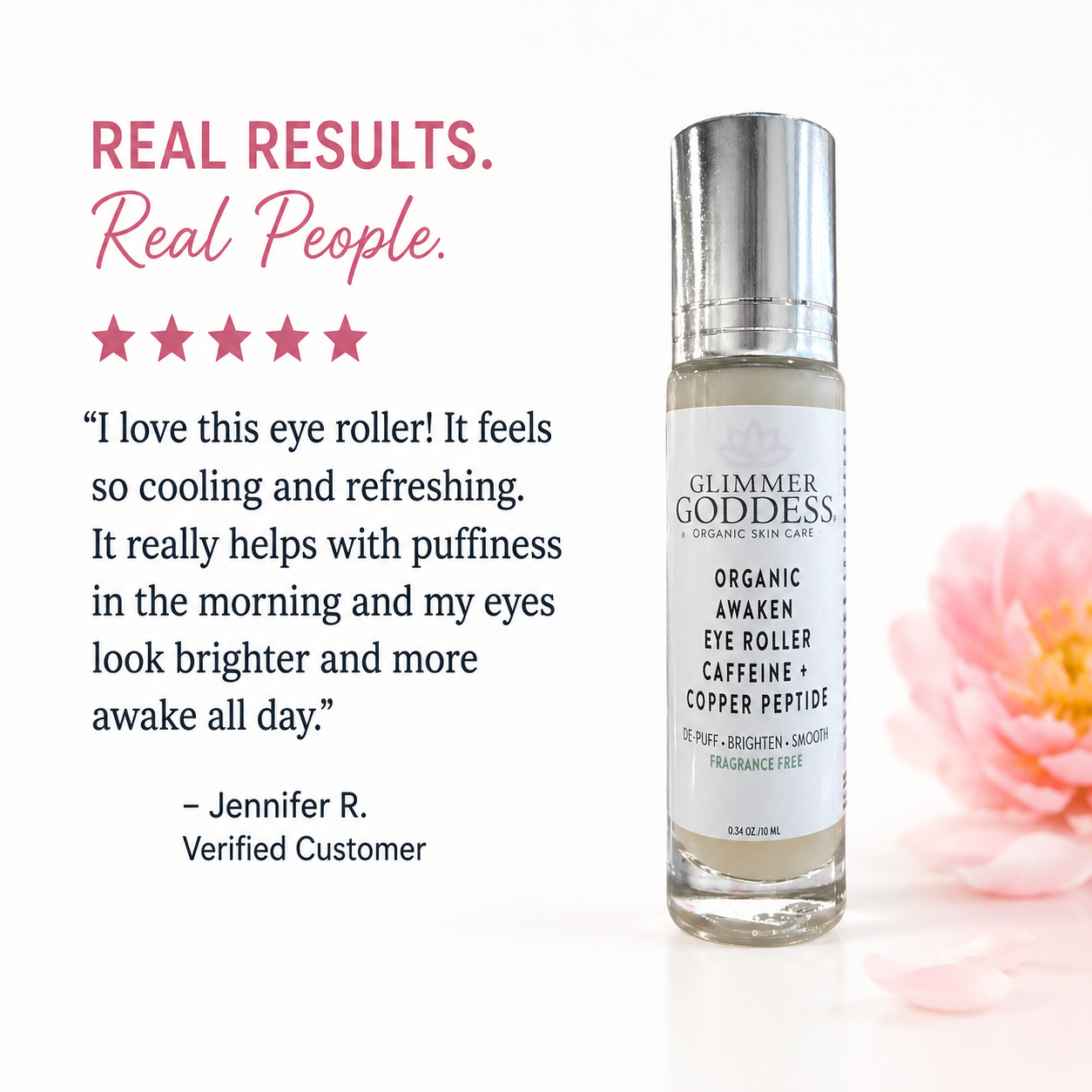 Glimmer Goddess Organic Awaken Eye Roller bottle on a white background with promotional text and a pink flower. The bottle has a silver cap and a white label with black text.