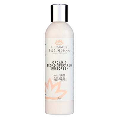 Organic reef-safe sunscreen lotion from Glimmer Goddess with broad spectrum SPF 40, featuring a white tube with orange accents.