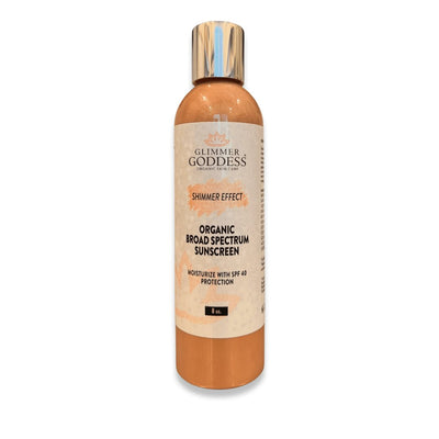 Organic broad spectrum sunscreen with shimmer effect, SPF 40 moisturizer in gold bottle