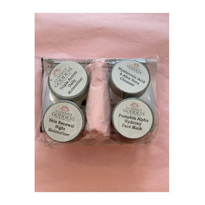 Glimmer Goddess organic skincare set with moisturizers, cleanser & face mask in clear packaging